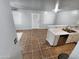 Open kitchen with stainless steel appliances, bright countertops, and ample cabinet space at 125 S 56Th St # 75, Mesa, AZ 85206