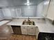 Bright kitchen featuring marble countertops, stainless steel dishwasher, and double basin sink at 125 S 56Th St # 75, Mesa, AZ 85206