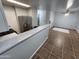 Open concept kitchen with stainless steel appliances and breakfast bar at 125 S 56Th St # 75, Mesa, AZ 85206