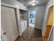 A laundry room with washer and dryer and an adjoining bathroom, offering convenience and functionality at 125 S 56Th St # 75, Mesa, AZ 85206