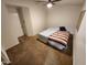 Cozy main bedroom featuring a ceiling fan and neutral-toned walls and carpet at 125 S 56Th St # 75, Mesa, AZ 85206