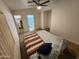 Spacious main bedroom featuring a ceiling fan, walk-in closet, and ensuite bathroom at 125 S 56Th St # 75, Mesa, AZ 85206