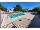 Relax by the fenced pool featuring lounge chairs and patio furniture for residents to enjoy at 125 S 56Th St # 75, Mesa, AZ 85206