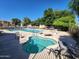 Enjoy a day at the pool with both a hot tub and a large swimming pool surrounded by plenty of chairs at 125 S 56Th St # 75, Mesa, AZ 85206