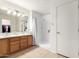 Bright bathroom features a double sink vanity and large walk-in shower at 14205 N 136Th Ln, Surprise, AZ 85379
