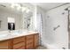 Bright bathroom features a double sink vanity and large walk-in shower at 14205 N 136Th Ln, Surprise, AZ 85379