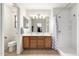Bright bathroom features a double sink vanity and large walk-in shower at 14205 N 136Th Ln, Surprise, AZ 85379