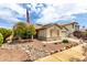 Charming single-Gathering home with desert landscaping and an American flag waving proudly at 14205 N 136Th Ln, Surprise, AZ 85379