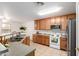 Well-maintained kitchen with ample cabinetry, appliances, and functional layout at 14205 N 136Th Ln, Surprise, AZ 85379