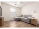 Living room with hardwood flooring, natural lighting, and a comfortable couch at 14205 N 136Th Ln, Surprise, AZ 85379