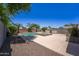 Spacious backyard with pool, spa, and ample patio space, perfect for entertaining guests at 14916 W Georgia Dr, Surprise, AZ 85379
