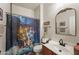 Bathroom with unique mirror and a Disney castle shower curtain at 14916 W Georgia Dr, Surprise, AZ 85379