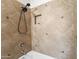 Bathroom with custom tile surround, rainfall shower head and built-in niche at 14916 W Georgia Dr, Surprise, AZ 85379