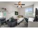 Bedroom features stylish decor, a large mirror, and natural light at 14916 W Georgia Dr, Surprise, AZ 85379