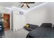 Bright bedroom with LED lighting and a view into the kitchen at 14916 W Georgia Dr, Surprise, AZ 85379