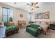 Bright bedroom with unique Disney-themed decor and carpeted flooring at 14916 W Georgia Dr, Surprise, AZ 85379