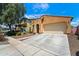 Inviting single-Gathering home with a two-car garage and a well-manicured front yard at 14916 W Georgia Dr, Surprise, AZ 85379