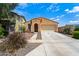 Lovely single-Gathering home with a two-car garage and lush landscaping at 14916 W Georgia Dr, Surprise, AZ 85379
