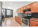 A kitchen featuring wood cabinets, granite countertops and stainless steel appliances at 14916 W Georgia Dr, Surprise, AZ 85379