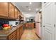 This kitchen features stylish wooden cabinets and a retro pink refrigerator at 14916 W Georgia Dr, Surprise, AZ 85379