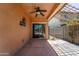 Covered patio area with ceiling fan and view of the fenced backyard with pool at 14916 W Georgia Dr, Surprise, AZ 85379