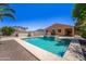 Inviting pool and spa create a relaxing backyard retreat with covered patio access at 14916 W Georgia Dr, Surprise, AZ 85379