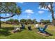 Well-maintained lawn with Adirondack chairs offering a peaceful outdoor retreat at 1601 N Saba St # 308, Chandler, AZ 85225