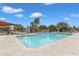 Resort-style pool area with sun loungers and shaded seating for relaxation and enjoyment at 1601 N Saba St # 308, Chandler, AZ 85225
