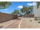 Path alongside brick wall with plants and trees at 1601 N Saba St # 308, Chandler, AZ 85225