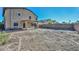 Backyard featuring a covered patio, privacy wall, and potential for outdoor living at 16112 W Durango St, Goodyear, AZ 85338
