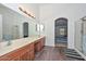 Large bathroom with dual vanity, wood look flooring and seperate shower at 16112 W Durango St, Goodyear, AZ 85338