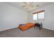 Bedroom with carpet, ceiling fan, and window at 16112 W Durango St, Goodyear, AZ 85338