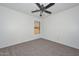 Bedroom featuring carpet flooring, a ceiling fan, and a window at 16112 W Durango St, Goodyear, AZ 85338