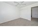 Bedroom with carpet, closet, and access to another room at 16112 W Durango St, Goodyear, AZ 85338