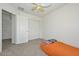 Bedroom with carpet, ceiling fan, and closet at 16112 W Durango St, Goodyear, AZ 85338