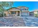 Charming two-story home with a covered porch and a two-car garage and low maintenance landscaping at 16112 W Durango St, Goodyear, AZ 85338