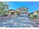 Charming two-story home with a covered porch and a two-car garage and low maintenance landscaping at 16112 W Durango St, Goodyear, AZ 85338