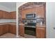Close-up of a kitchen corner with brick accents and modern appliances at 16112 W Durango St, Goodyear, AZ 85338