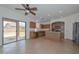 Modern kitchen featuring stainless steel appliances and a view of the backyard at 16112 W Durango St, Goodyear, AZ 85338
