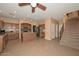 Open-concept kitchen featuring an island, stainless steel appliances, and tile flooring at 16112 W Durango St, Goodyear, AZ 85338