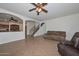 Open-concept living area connecting the kitchen and staircase with comfortable seating at 16112 W Durango St, Goodyear, AZ 85338