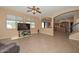 Spacious living room featuring tile floors and multiple windows for natural light at 16112 W Durango St, Goodyear, AZ 85338