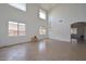 Spacious living room with tile flooring, high ceilings, and clerestory windows at 16112 W Durango St, Goodyear, AZ 85338