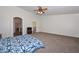 Spacious main bedroom featuring a ceiling fan and ensuite bathroom access at 16112 W Durango St, Goodyear, AZ 85338
