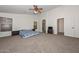 Large bedroom with a ceiling fan and lots of natural light at 16112 W Durango St, Goodyear, AZ 85338