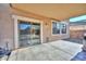 Covered patio with sliding glass door and windows, offering indoor-outdoor flow at 16112 W Durango St, Goodyear, AZ 85338