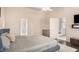 A soothing primary bedroom features an attached bath, a dresser and natural light at 16153 W Lisbon Ln, Surprise, AZ 85379