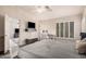 Tranquil primary bedroom features a ceiling fan, home office, and ample sunlight at 16153 W Lisbon Ln, Surprise, AZ 85379
