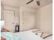 Sunny bedroom with a ceiling fan, a comfy bed and an ensuite bathroom at 16153 W Lisbon Ln, Surprise, AZ 85379