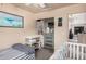 Bedroom featuring a crib, daybed, and charming ocean themed wall decor at 16153 W Lisbon Ln, Surprise, AZ 85379